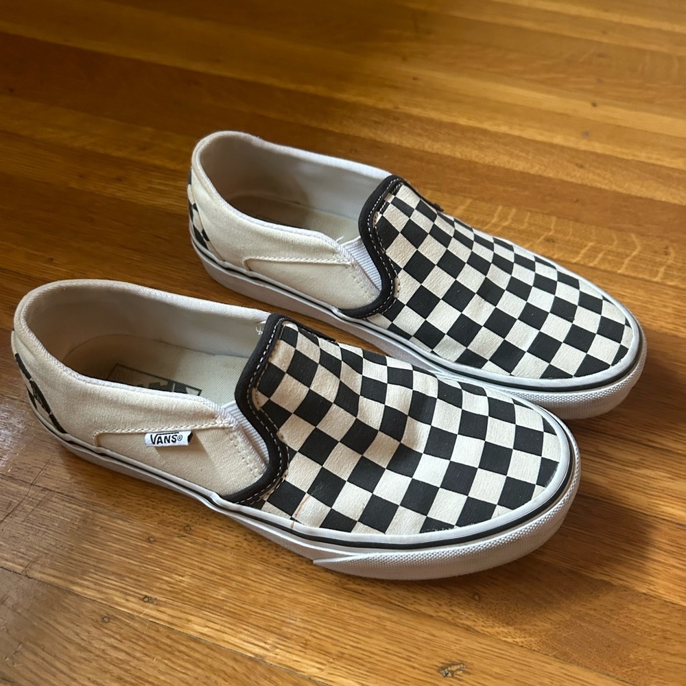 Vans black and white slip on sneakers